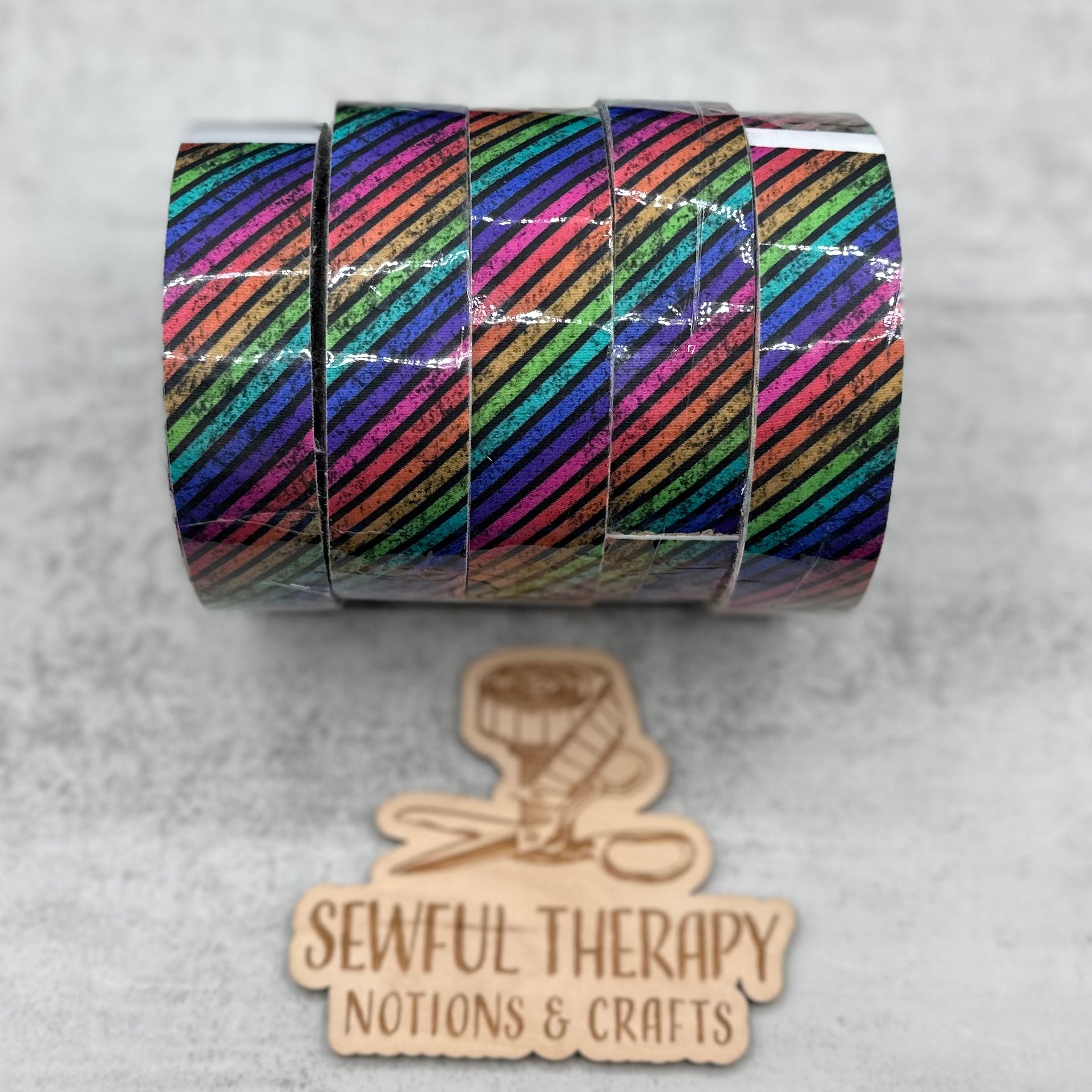 1" Stick 'n Sew™ Self-Adhesive Binding Tape in Diagonal Rainbow Grunge Stripes (10 Yard Roll)