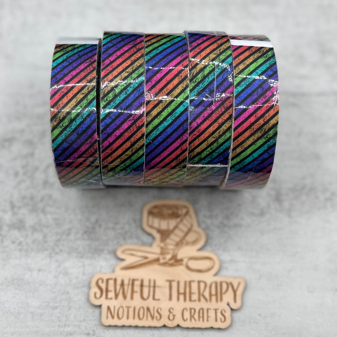 1" Stick 'n Sew™ Self-Adhesive Binding Tape in Diagonal Rainbow Grunge Stripes (10 Yard Roll)